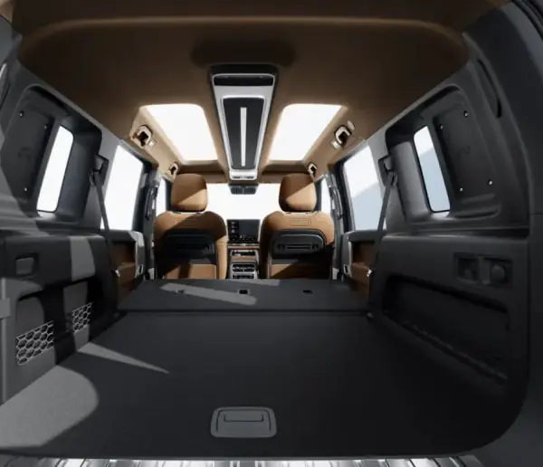 V27 REEV rear seats folded flat into a sleeping deck